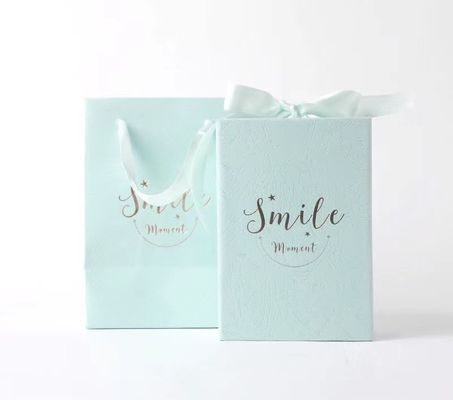 Cosmetic Package Coated Paper Foldable Box With Ribbon Hot Stamping